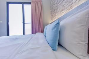 Cama ou camas em um quarto em Huayu Homestay