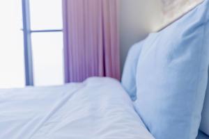 Cama ou camas em um quarto em Huayu Homestay