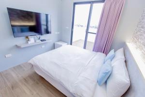 Cama ou camas em um quarto em Huayu Homestay