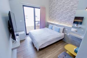 Cama ou camas em um quarto em Huayu Homestay