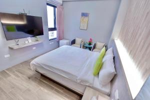 Cama ou camas em um quarto em Huayu Homestay