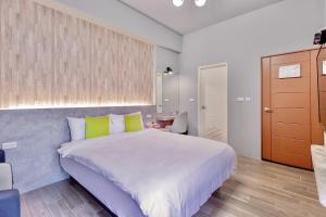 Cama ou camas em um quarto em Huayu Homestay