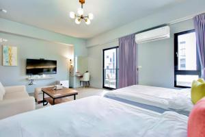 Cama ou camas em um quarto em Huayu Homestay
