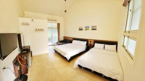 Katil atau katil-katil dalam bilik di Yuzhou Garden B&B