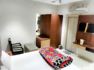 A bed or beds in a room at RBS Hotel & Restaurant 5 mint walking distance from Ram Janam Bhumi