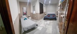 Posteľ alebo postele v izbe v ubytovaní Apartamentos centro histórico