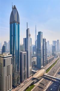 a view of a city with many tall buildings at Rose Rayhaan by Rotana - Dubai in Dubai