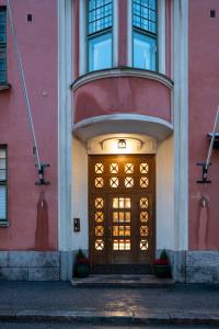 a building with a large door in front of it at 2ndhomes Luminous & Modern 107m2 Penthouse in Kruununhaka in Helsinki