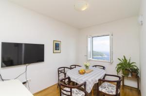 Televízia a/alebo spoločenská miestnosť v ubytovaní Medi Apartment