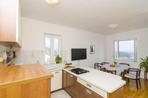 Kuchyňa alebo kuchynka v ubytovaní Medi Apartment