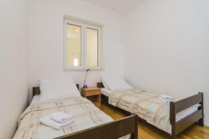 Posteľ alebo postele v izbe v ubytovaní Medi Apartment