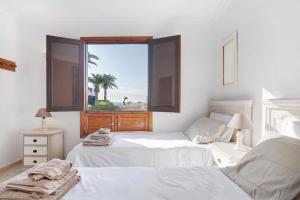 Posteľ alebo postele v izbe v ubytovaní Perla del Playa Grande + 17 fotografií