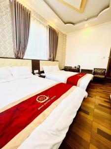 Postel nebo postele na pokoji v ubytování Bình Dương Đà Lạt Hotel