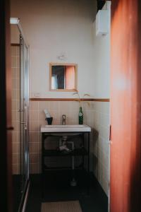 a bathroom with a sink and a mirror at 島中大厝 in Jinhu +66 photos