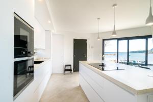 Küche/Küchenzeile in der Unterkunft Seashore House " Es tamarells"