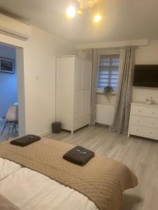 Postel nebo postele na pokoji v ubytování Apartamenty u Ewy - EUROS