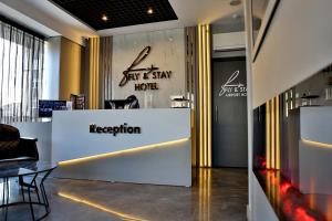 a lobby of a store with a reception desk at Fly And Stay Airport Hotel in Istanbul