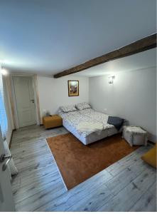 a bedroom with a large bed in a room at Вила Деливерски in Starosel