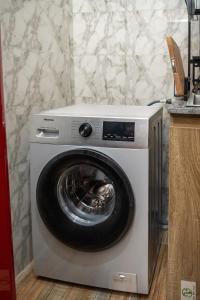a washer and dryer in a kitchen at Lakeview 2-Bed-Apt With Amazing Views In Every Direction in Amuwo
