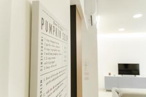 a poster on a wall in a room at SPA & RELAX Aesthetic Apartment 50m dal mare in Monopoli