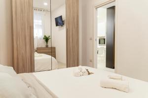 Katil atau katil-katil dalam bilik di SPA & RELAX Aesthetic Apartment 50m dal mare