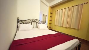 Postel nebo postele na pokoji v ubytování Muffys Guest House