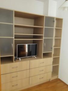 a living room with a tv in a closet at Odmor u Zagrebu in Zagreb