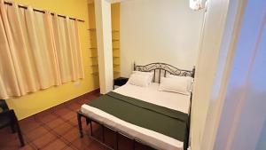 Postel nebo postele na pokoji v ubytování Muffys Guest House