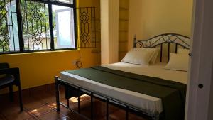 Postel nebo postele na pokoji v ubytování Muffys Guest House