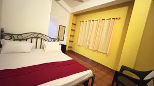 Postel nebo postele na pokoji v ubytování Muffys Guest House