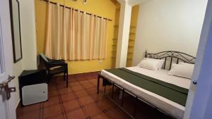 Postel nebo postele na pokoji v ubytování Muffys Guest House