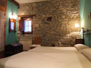 מיטה או מיטות בחדר ב-Finca el Palacio