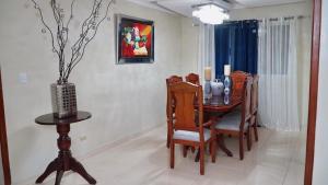 a dining room with a wooden table and chairs at BALCONYN 2 SEGURIDAD 24h in La Guáyiga