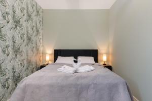 Posteľ alebo postele v izbe v ubytovaní Green Square Apartments Świnoujście by Noclegi Renters