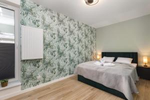 Posteľ alebo postele v izbe v ubytovaní Green Square Apartments Świnoujście by Noclegi Renters