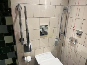 a bathroom with a white toilet in a shower at Hotel Indigo - Cardiff, an IHG Hotel in Cardiff