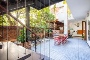 a room with a table and chairs and plants at Mare Nostrum Apart in Kaş