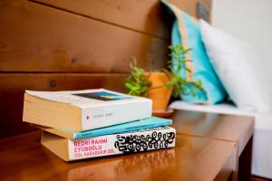 a stack of books sitting on a table at Mare Nostrum in Kas
