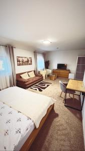 a bedroom with a bed and a living room at Hotel Algar in Opava