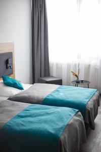 Postel nebo postele na pokoji v ubytování Hotel Am Park