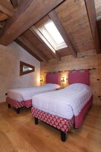 Postel nebo postele na pokoji v ubytování Chalets Mignon