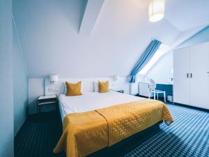 Łóżko lub łóżka w pokoju w obiekcie Hotel Villa Art Novis City Center