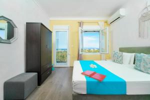 A bed or beds in a room at Meji House