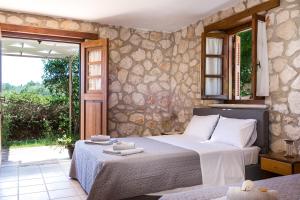Voodi või voodid majutusasutuse Abeloklima country house toas
