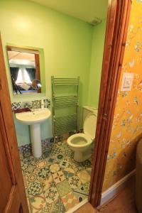 a bathroom with a toilet and a sink at Beaches BandB in Paignton +52 photos