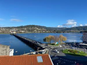 a view of a bridge over a body of water at O Faiado by Oktheway in Puentedeume