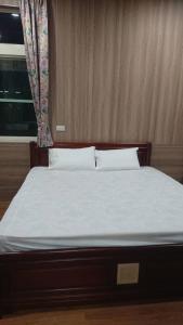 Giường trong phòng chung tại Ming Camphor Homestay