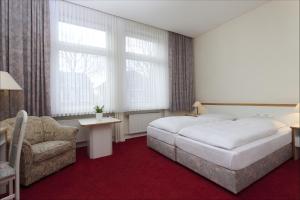 Cama o camas de una habitación en Gästehaus Kaiserhof Lübeck