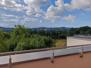 a view from the balcony of a house at Apartament Obłędny z tarasem i widokiem na góry in Kudowa-Zdrój