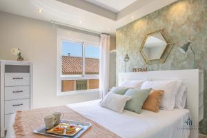 Posteľ alebo postele v izbe v ubytovaní Living4Malaga Picasso Deluxe Apartment